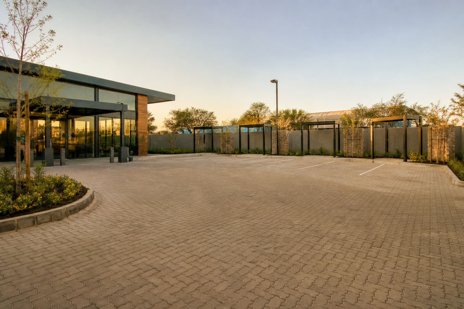 Wide interlocking paving across a commercial forecourt
